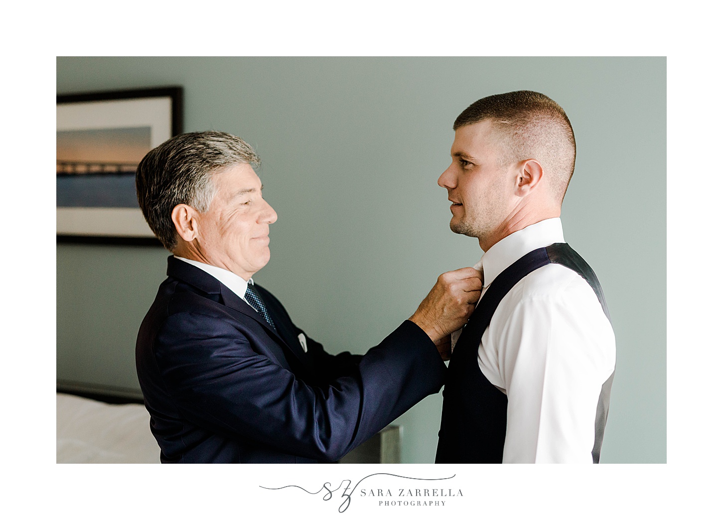 father helps groom with tie before RI wedding 