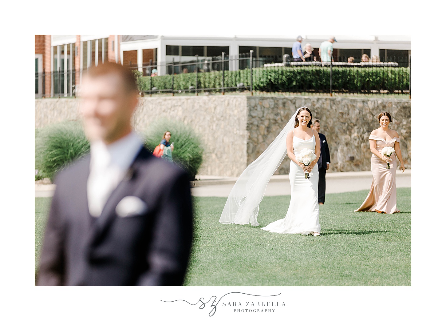 bride approaches groom for first look on lawn at the Wyndham Newport Hotel