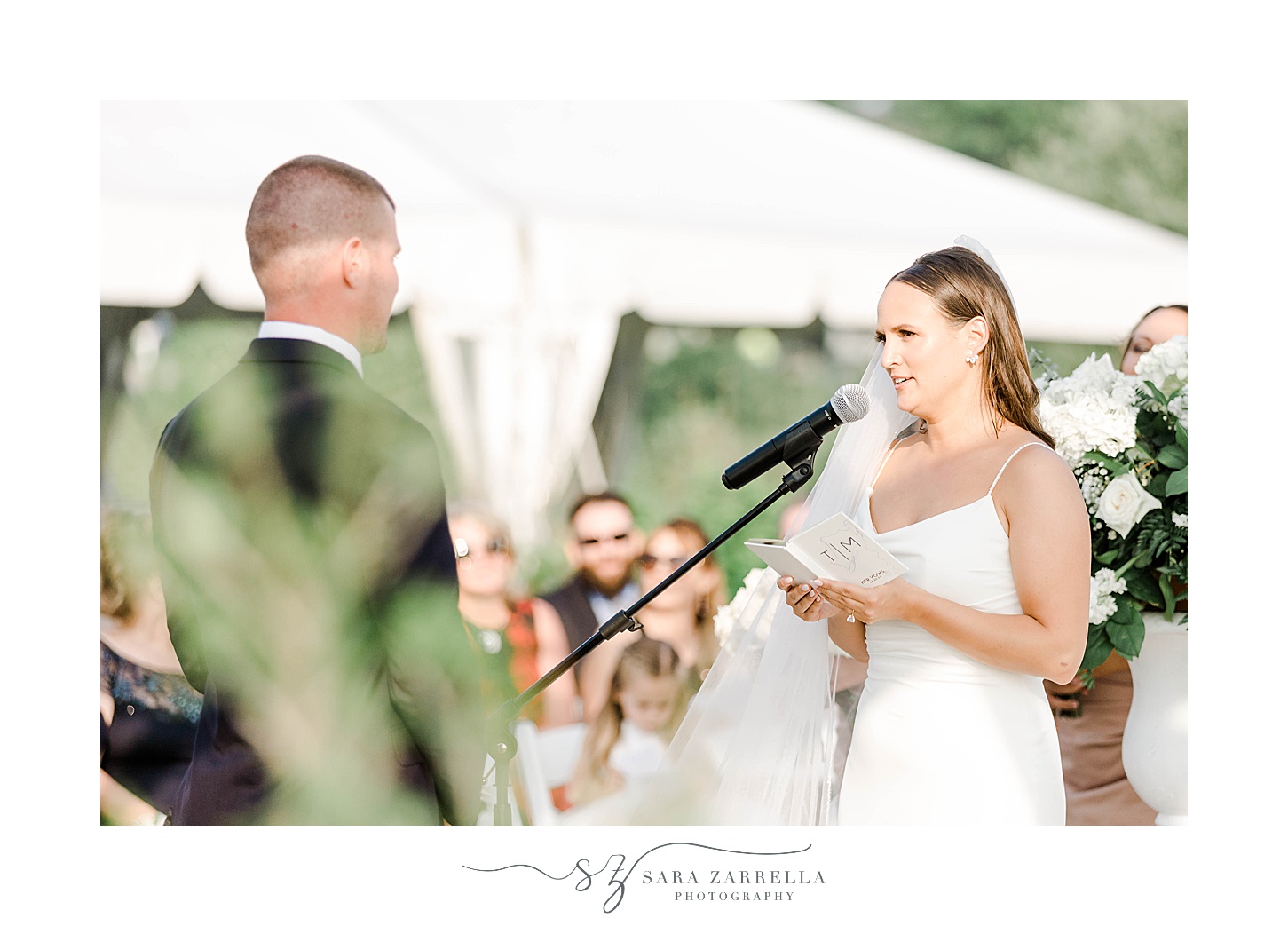 bride reads vows to groom during outside wedding ceremony in Newport, Rhode Island