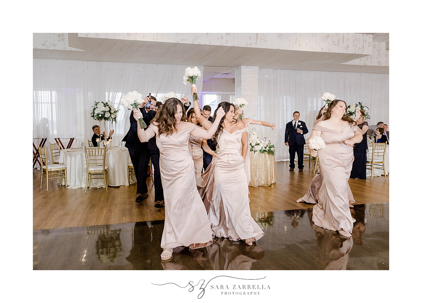bridesmaids dance onto floor at the Wyndham Newport Hotel wedding reception 