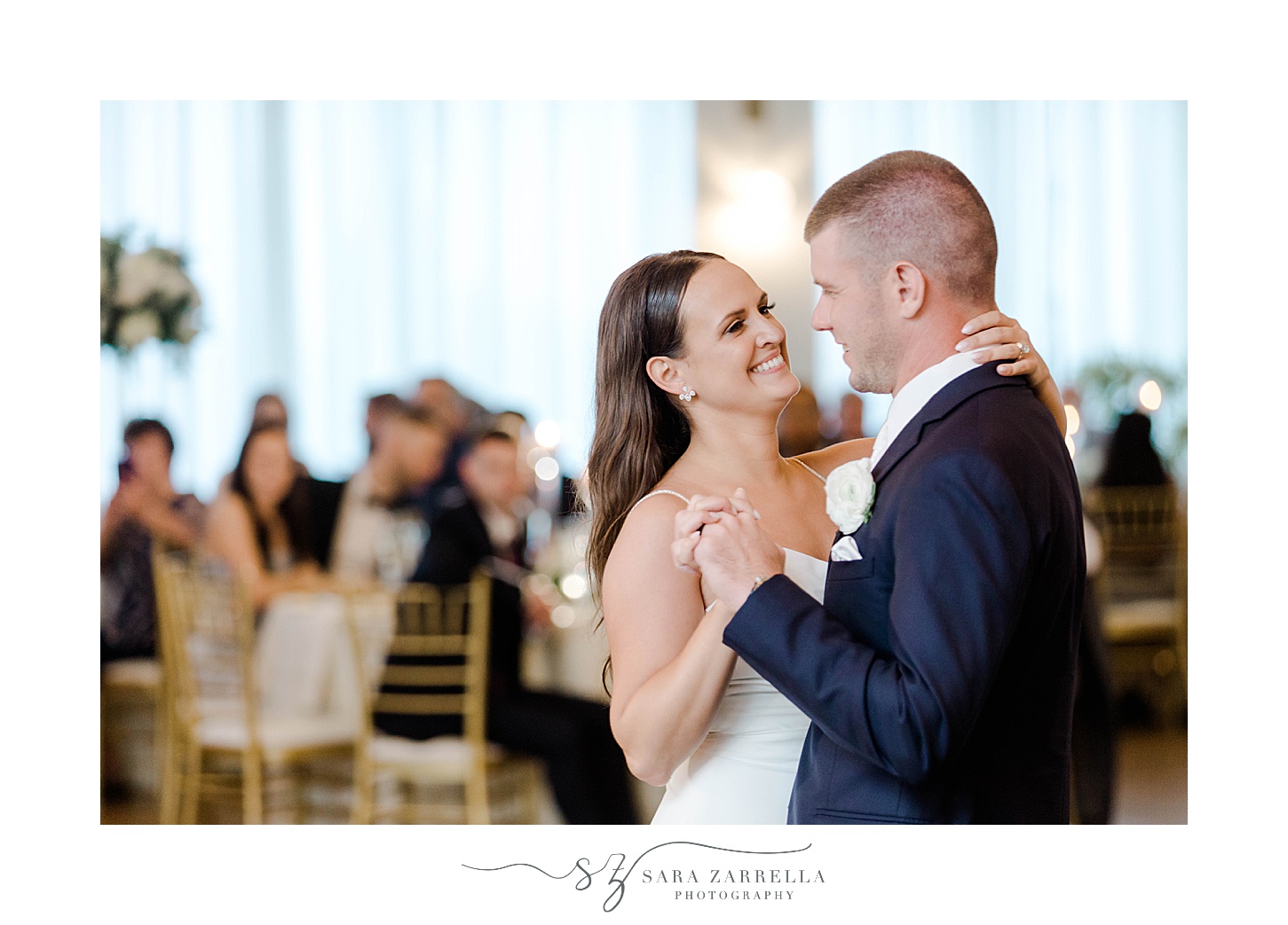 bride smiles up at groom during first dance in Newport RI