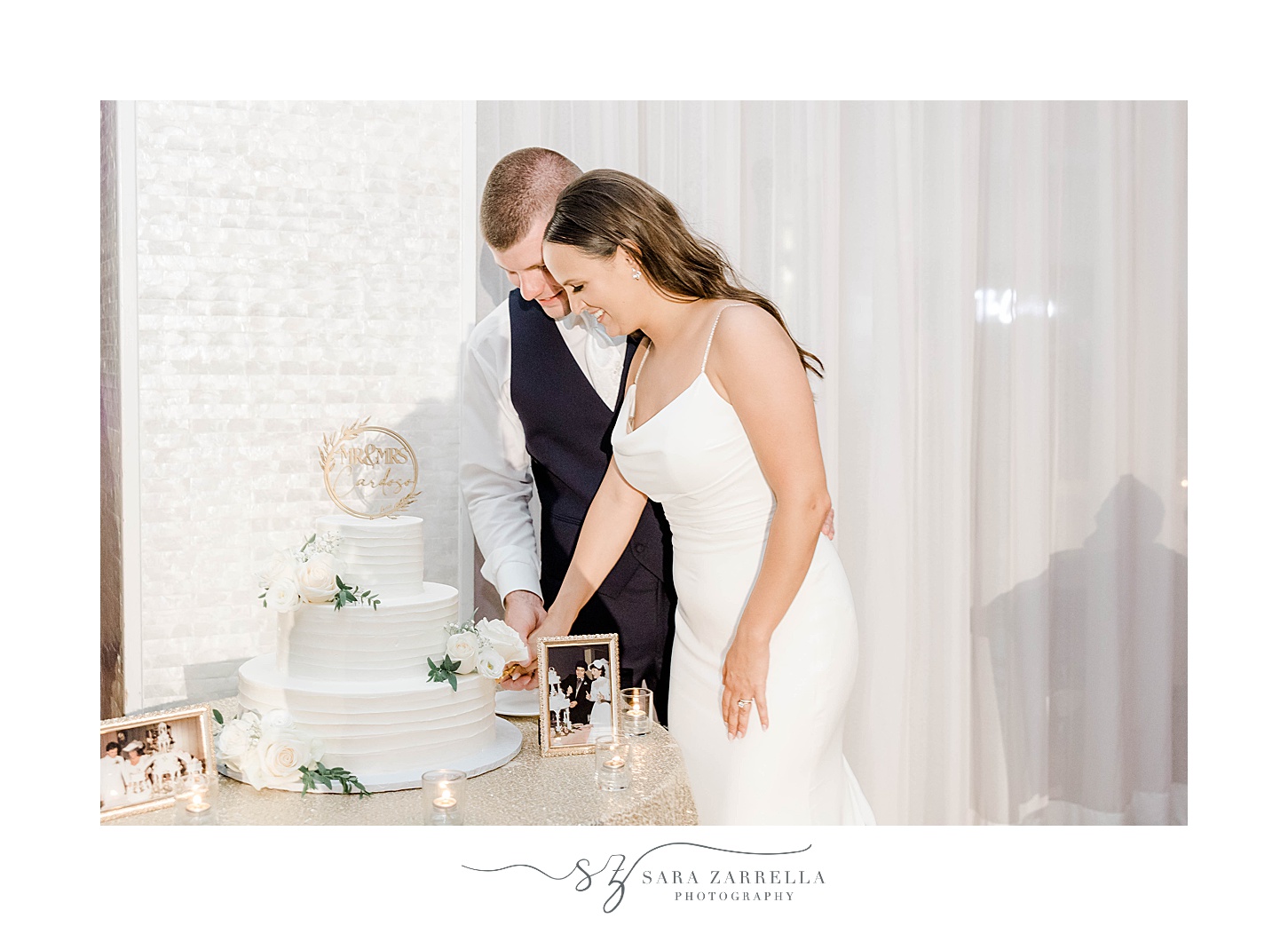 newlyweds cut wedding cake at the Wyndham Newport Hotel