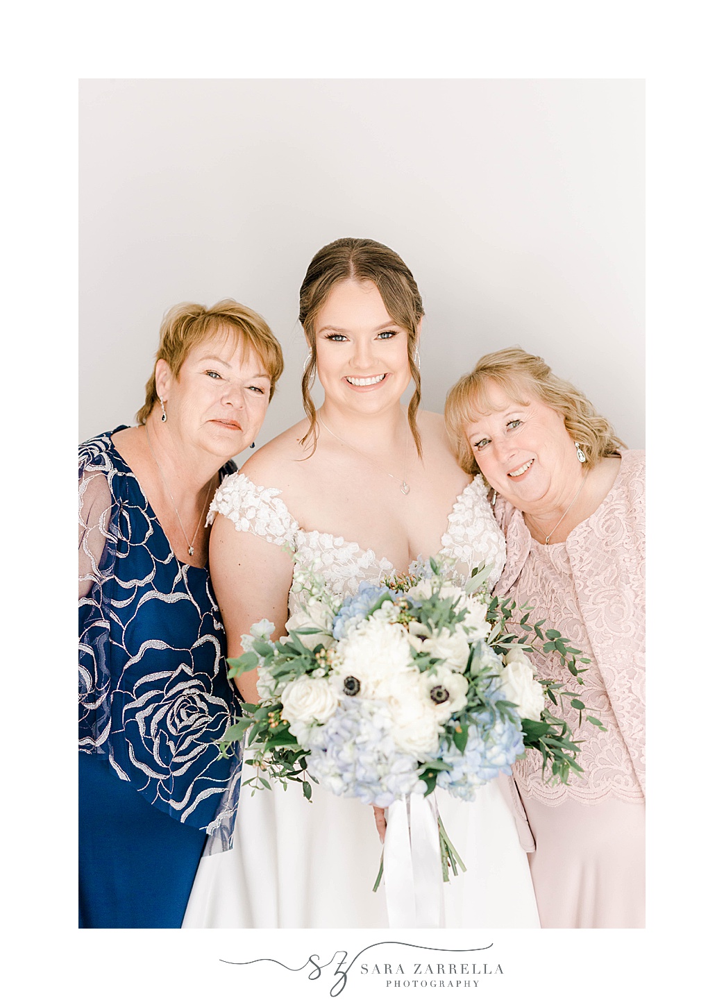 bride hugs grandmother and mother during prep for RI wedding 