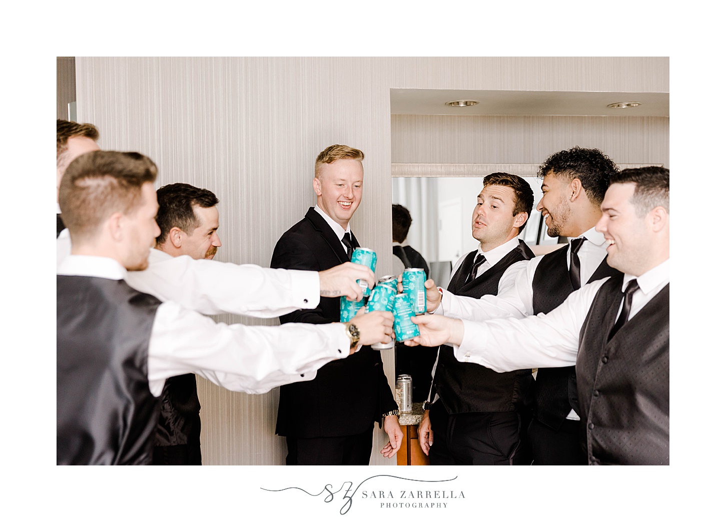 groom and groomsmen toast drinks before RI wedding 