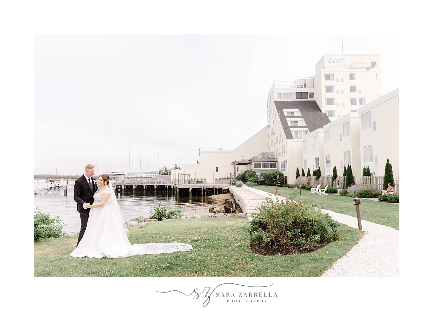 bride and groom pose outside Newport Harbor Island Resort