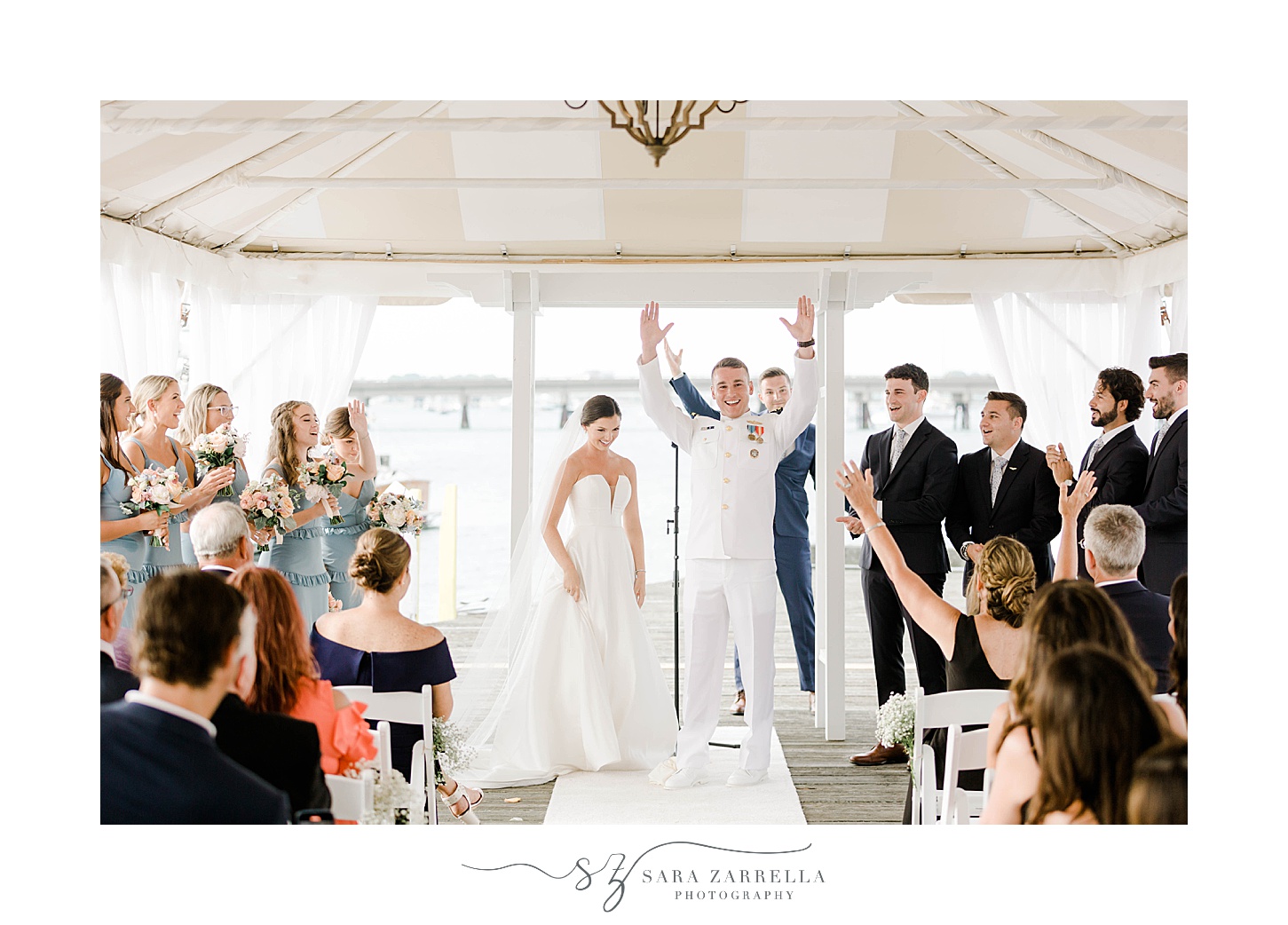 bride and groom cheer after wedding ceremony at Regatta Place