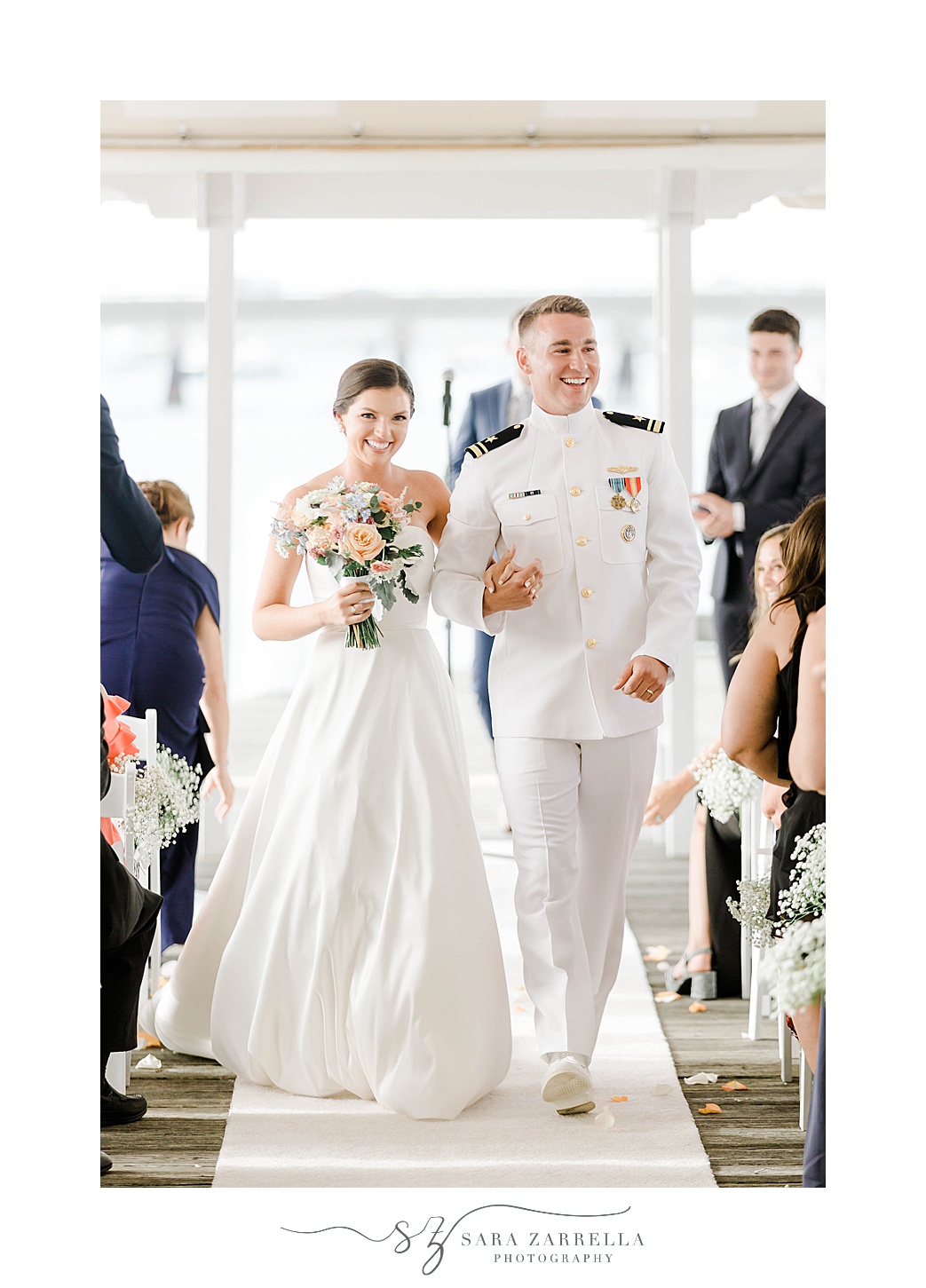 bride and groom walk up aisle after Regatta Place wedding ceremony