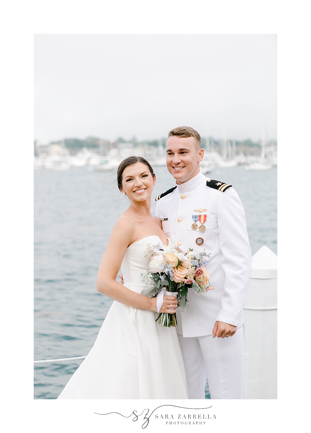 bride and groom stand on docks at Regatta Place