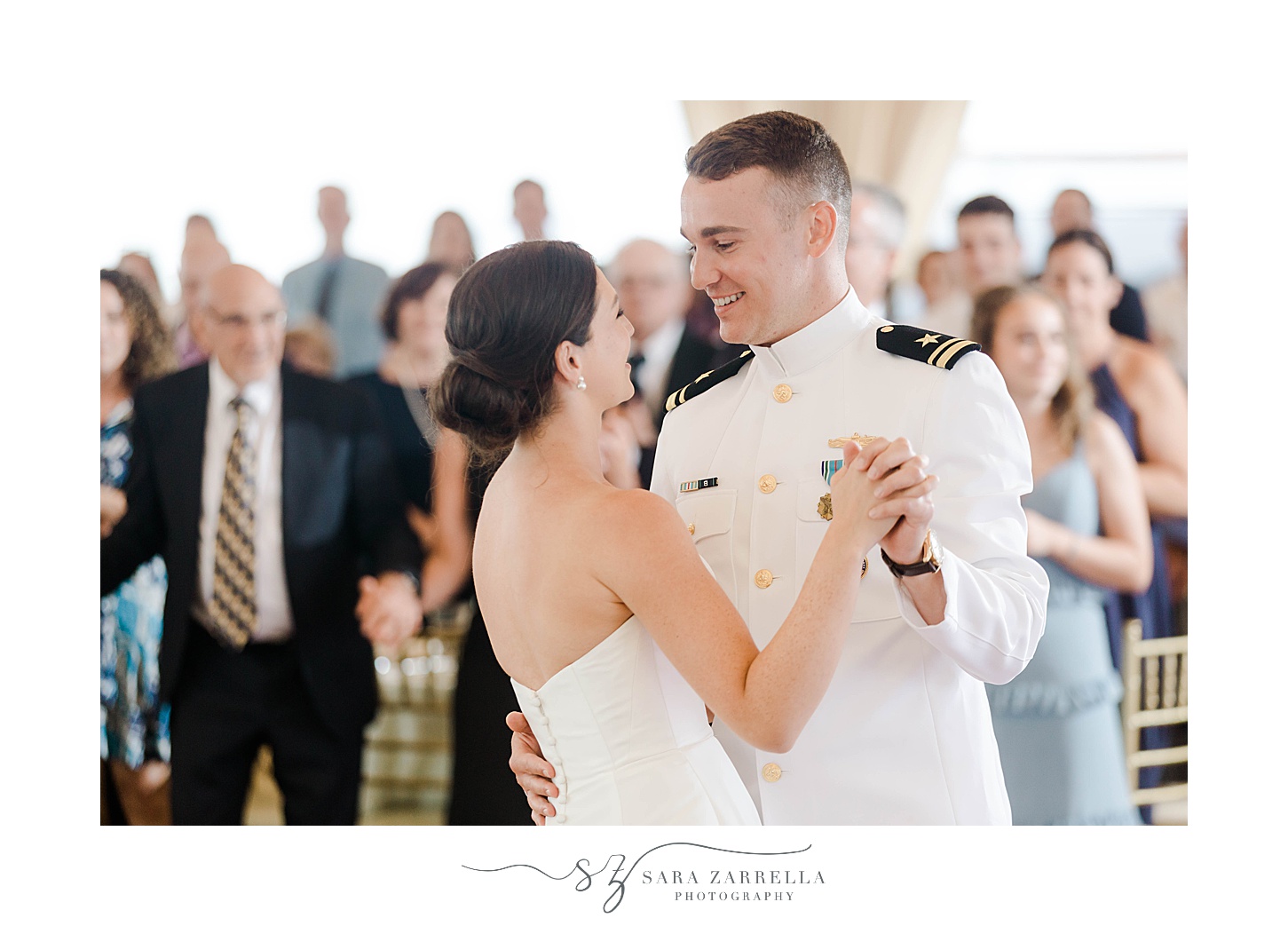 bride and groom dance together at Regatta Place wedding reception