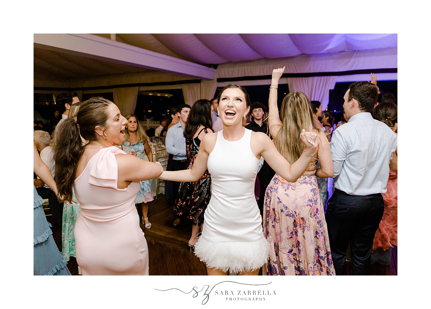 bride and guests dance during Regatta Place wedding reception