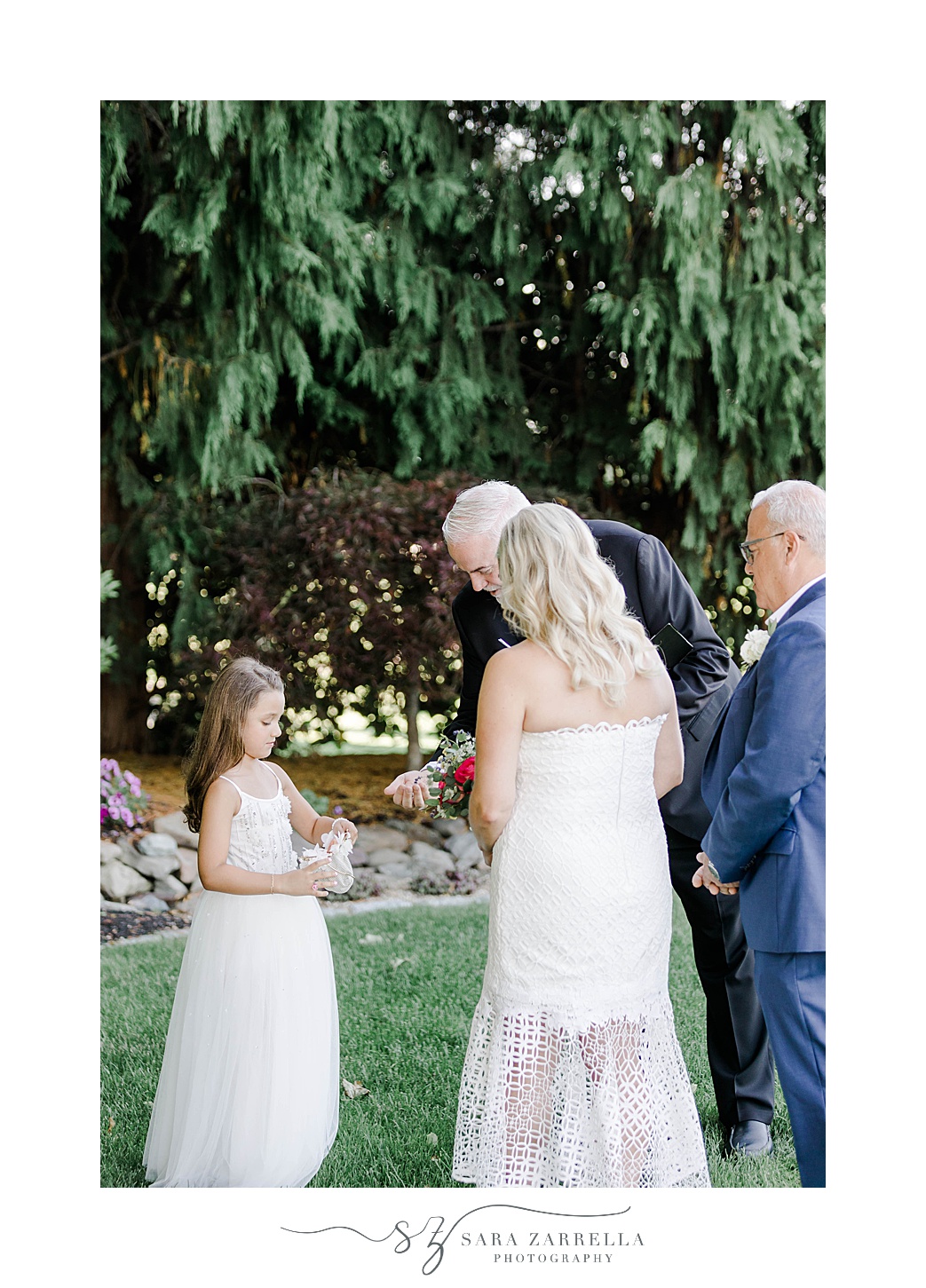 intimate ceremony in gardens at Kirkbrae Country Club for couple and flower girl 