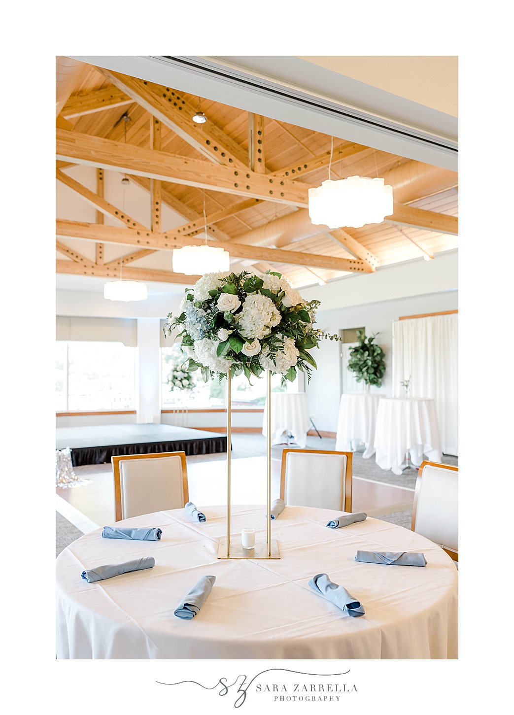 tall floral centerpieces with white flowers at Kirkbrae Country Club