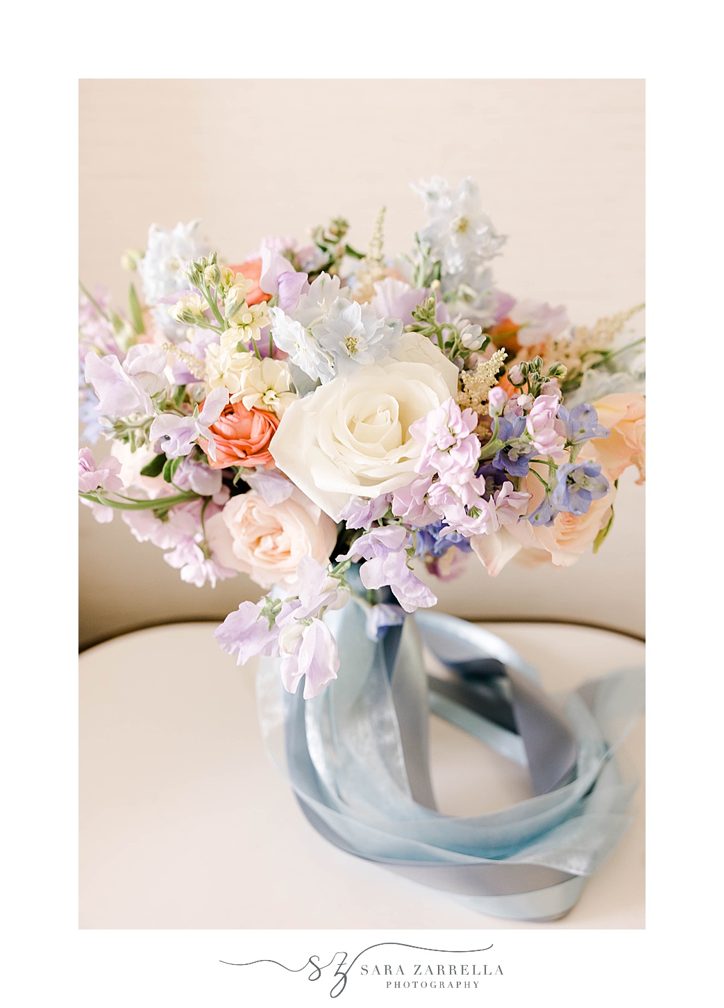 pastel bouquet with blue ribbon for Bridgerton inspired wedding at Newport Harbor Island Resort