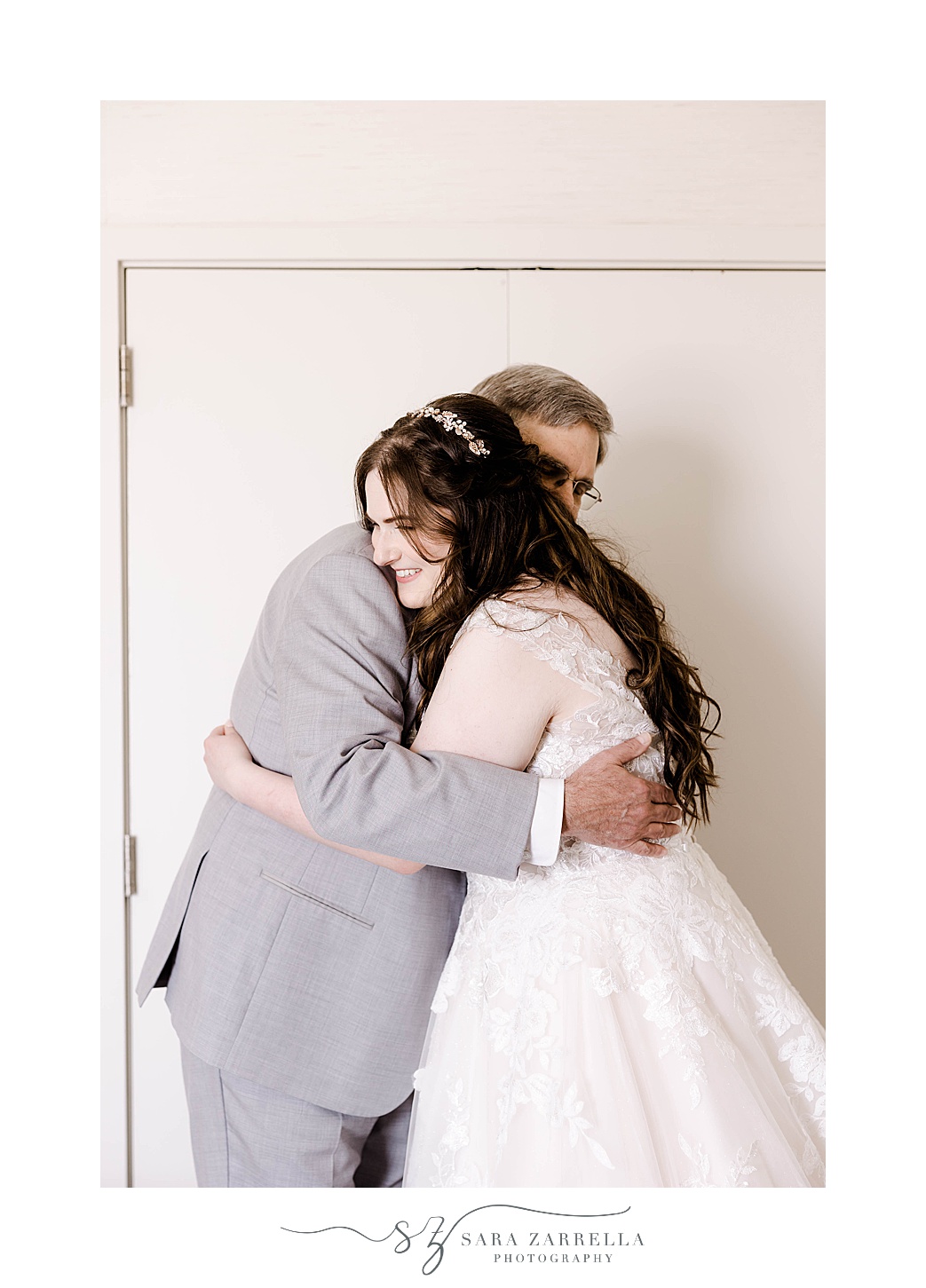 bride and father hug during first look at Newport Harbor Island Resort