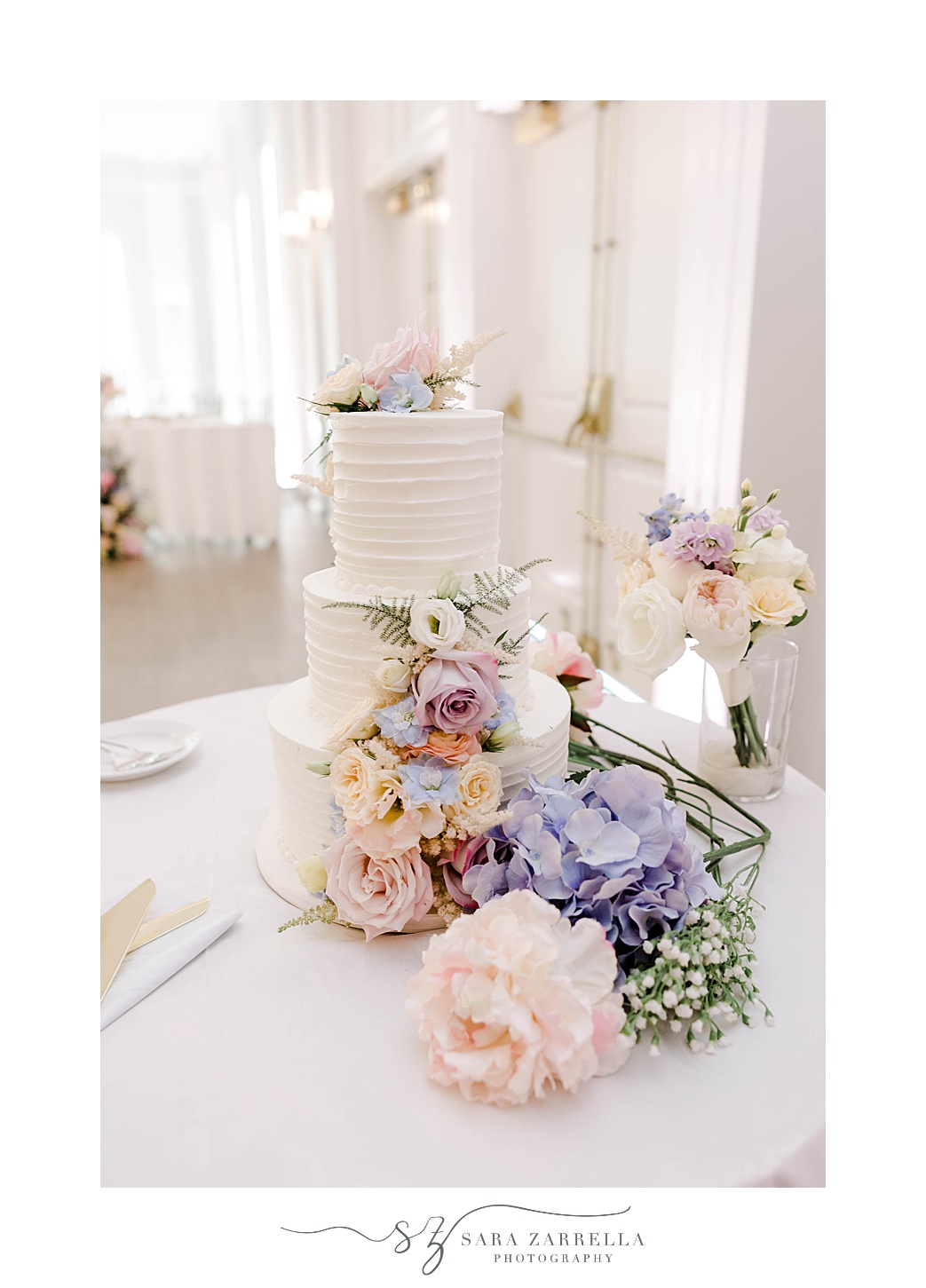wedding centerpiece with pink and purple flowers at Newport Harbor Island Resort