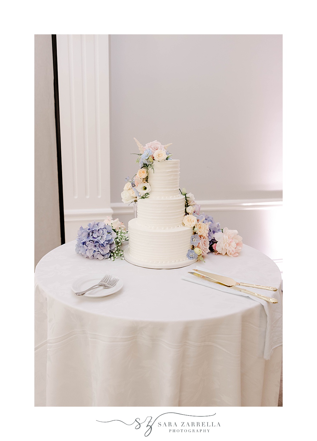 tiered wedding cake with pastel flowers in Newport RI