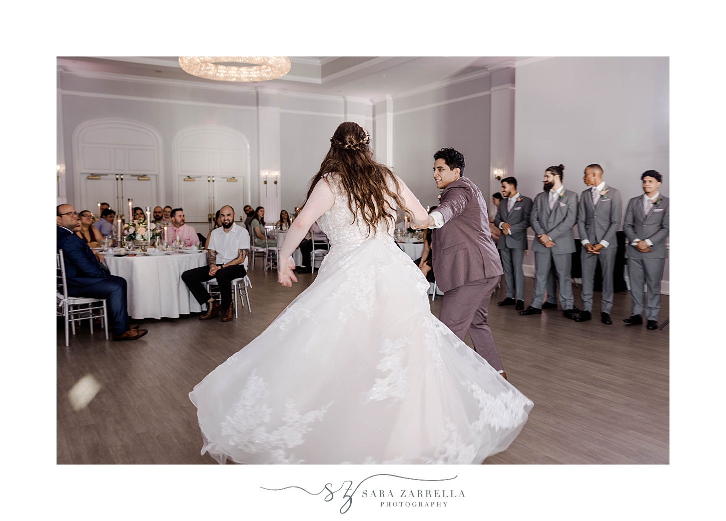 groom twirls out bride on dance floor at Newport RI wedding reception 