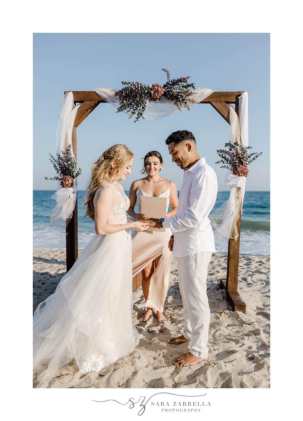 bride and groom exchange vows during Charlestown Beach wedding ceremony