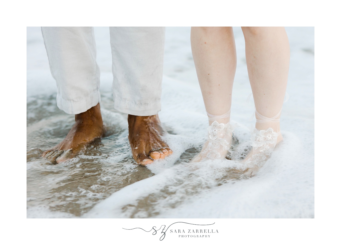 bride and groom put feet in ocean at Charlestown Beach