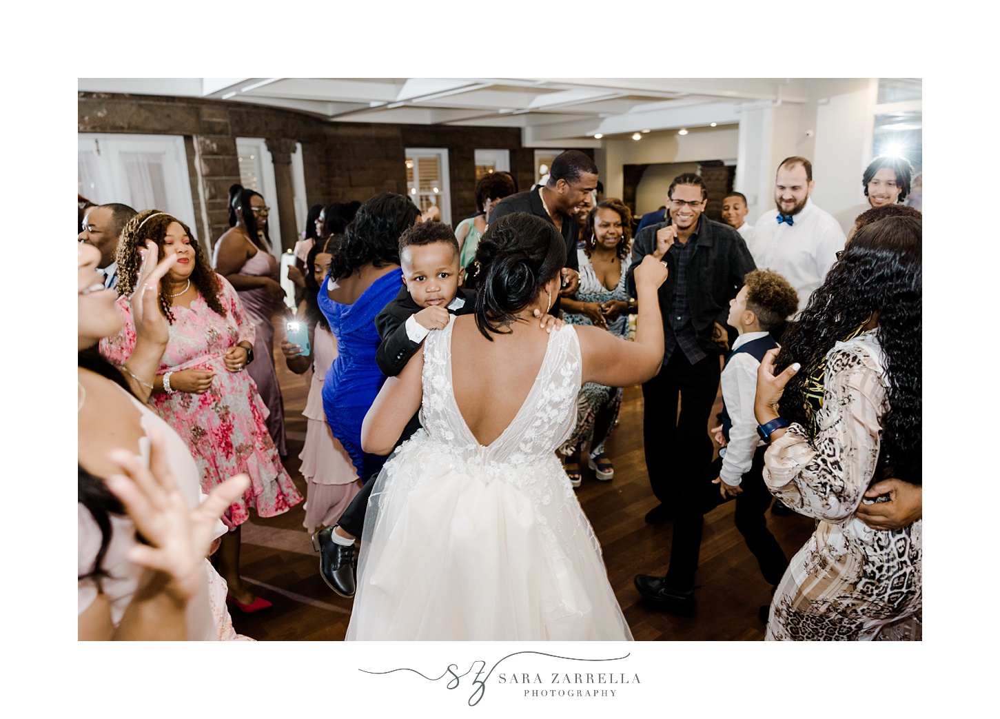 bride dances with guests during RI wedding reception