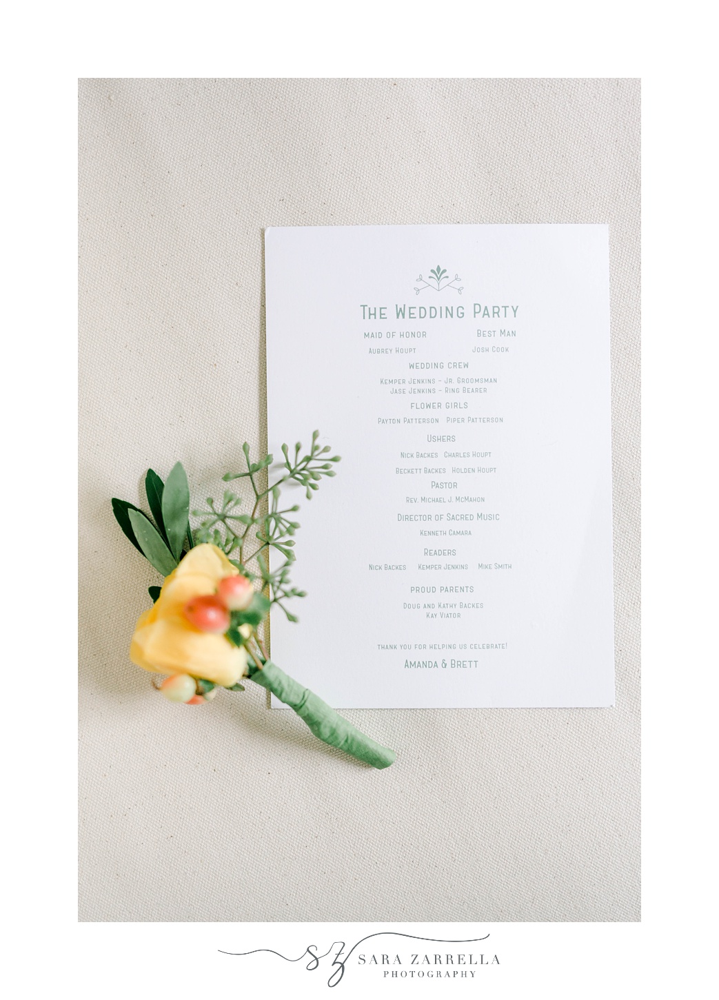 wedding invitation with bright yellow and orange boutonnière 