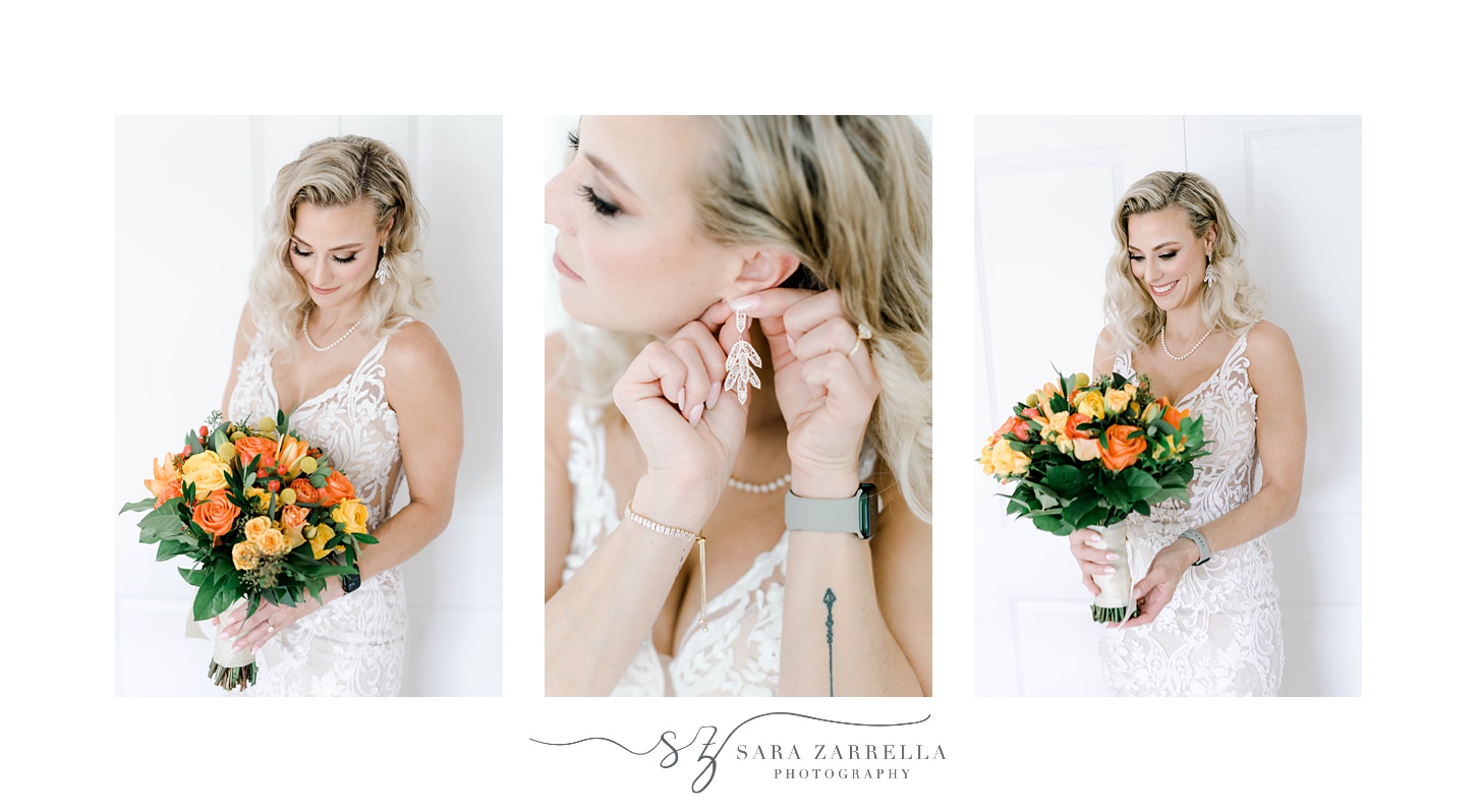 blonde bride adjusts earrings and holds bouquet of yellow and orange flowers 