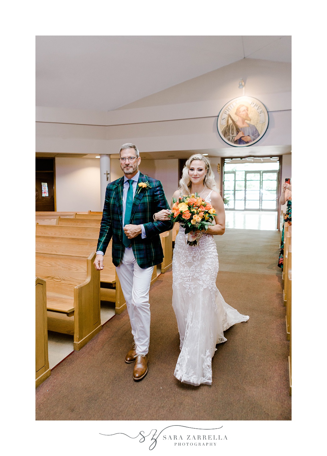 bride walks down aisle with father for traditional church wedding in Sutton MA