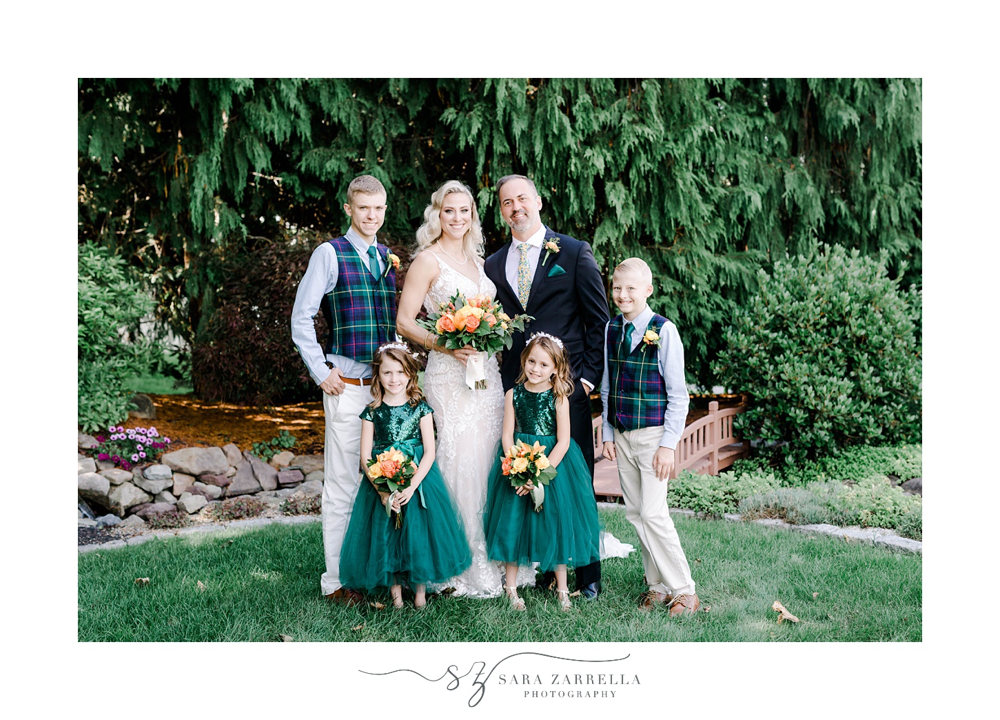 bride and groom pose with four children on lawn at Pleasant Valley Country Club