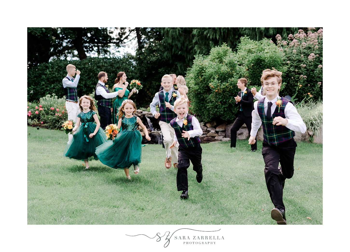 flower girls run after ring bearers on lawn at Pleasant Valley Country Club