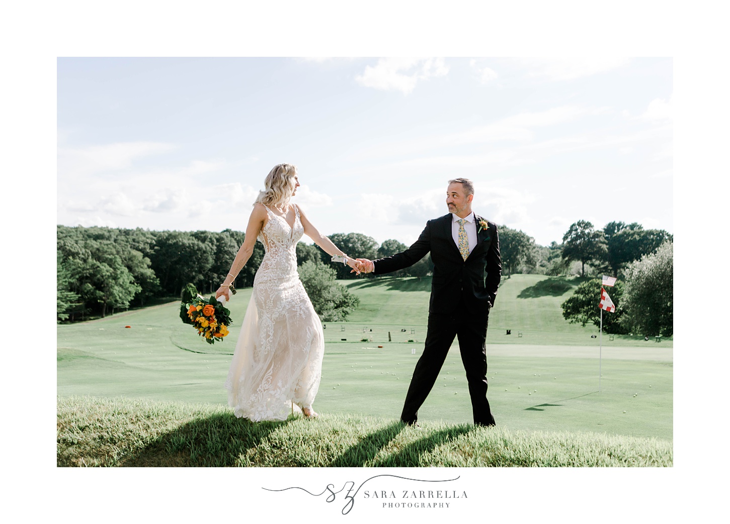 bride and groom hold hands walking on lawn at Pleasant Valley Country Club