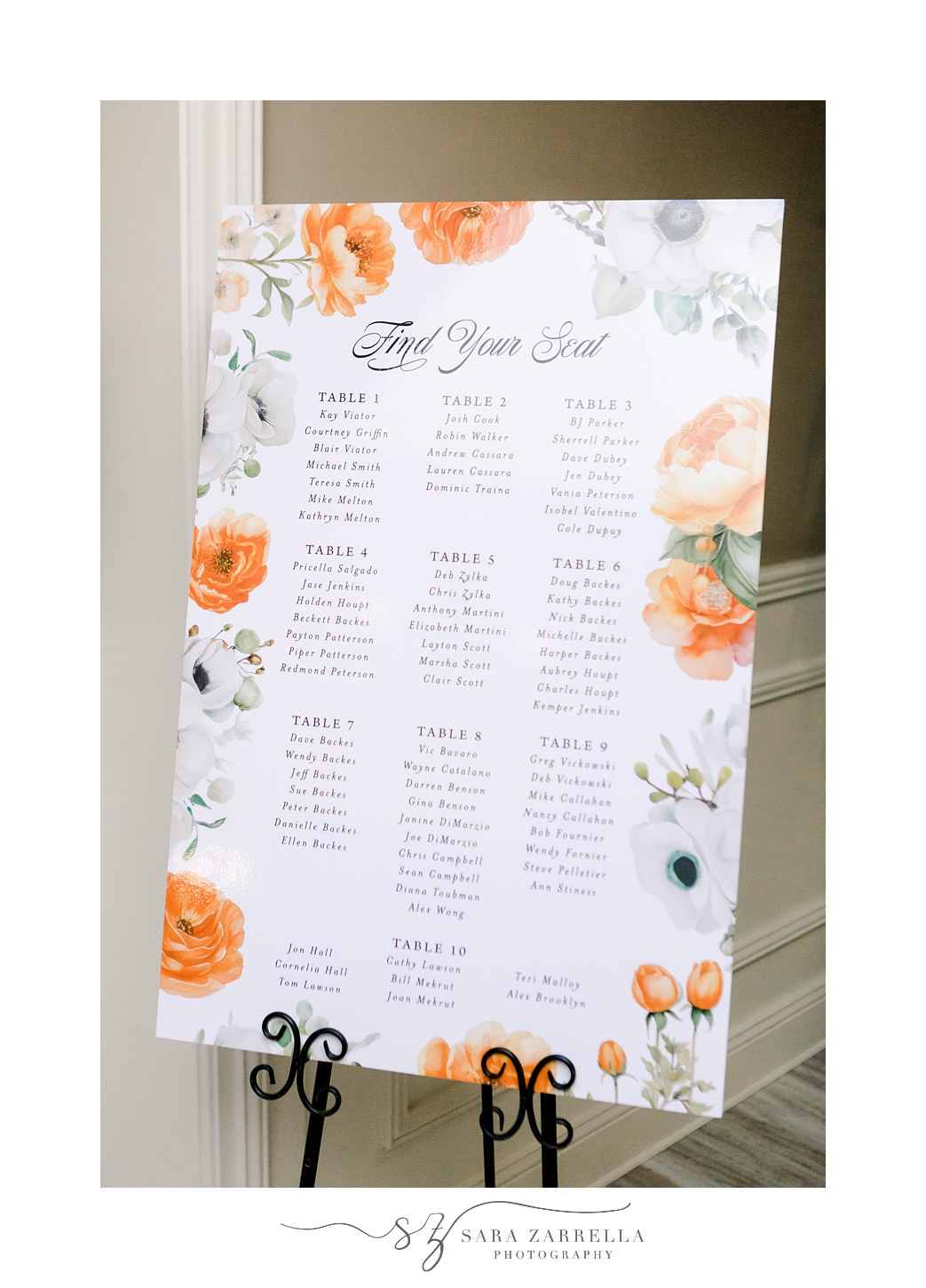 seating chart with orange flowers for summer wedding reception at Pleasant Valley Country Club