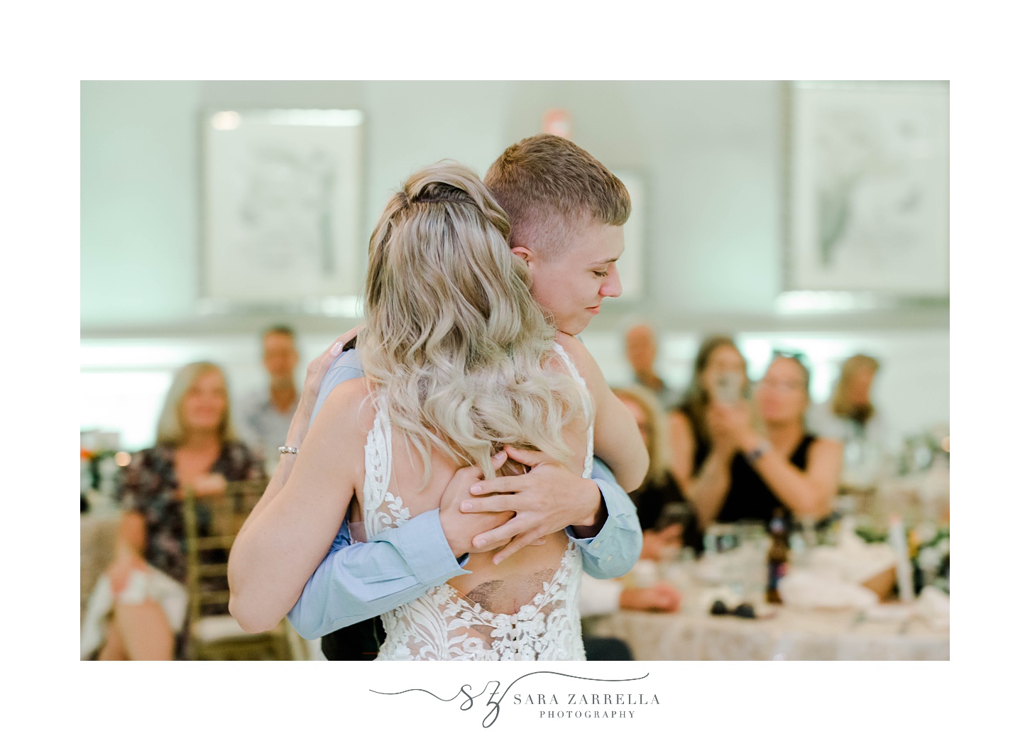 son hugs mother/bride during Sutton MA wedding reception
