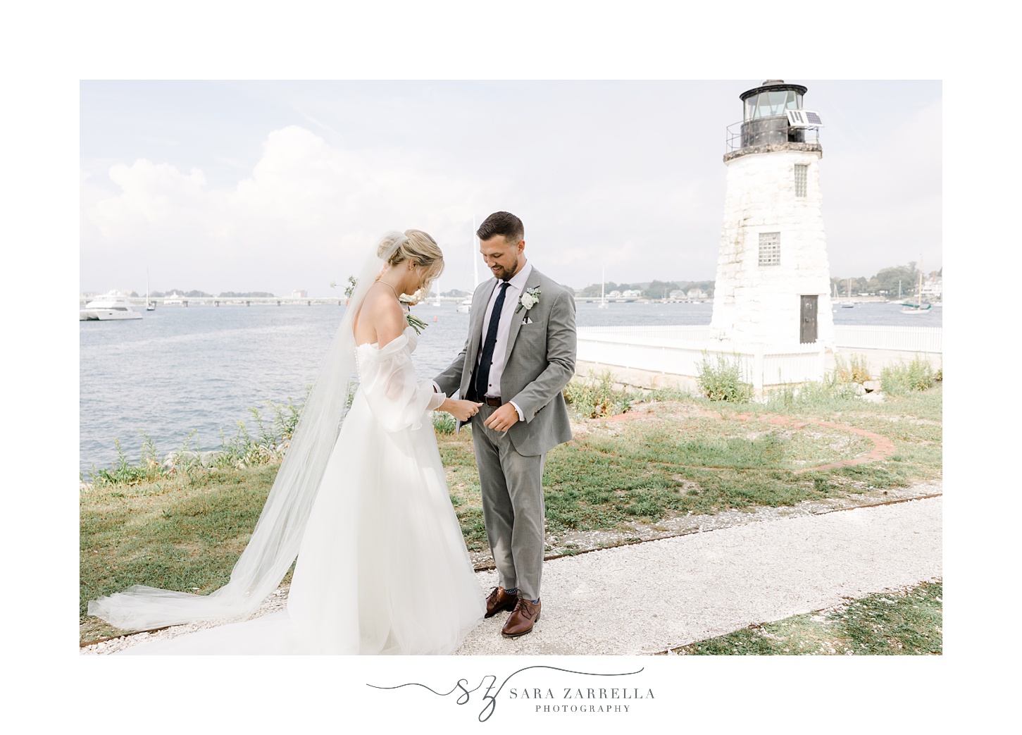 bride and groom look at bride's dress during first look at Newport Harbor Island Resort