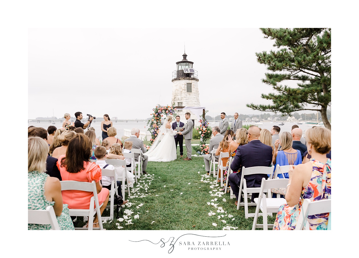wedding ceremony on lawn in front of Newport Lighthouse 