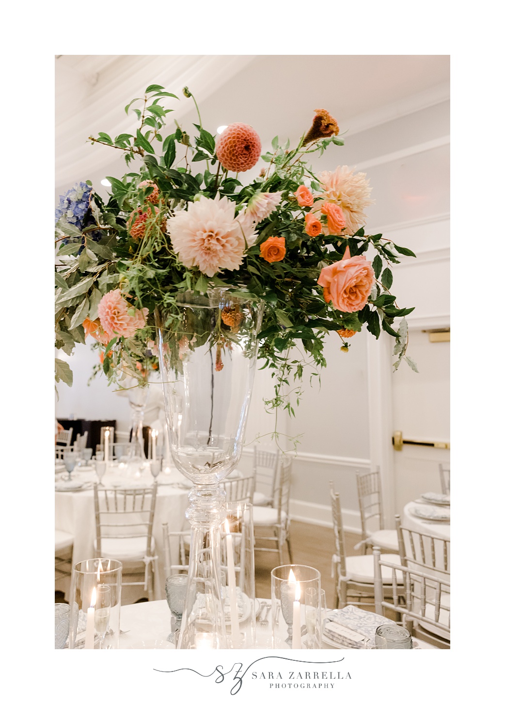 tall floral centerpiece with peach and pink flowers for reception at Newport Harbor Island Resort
