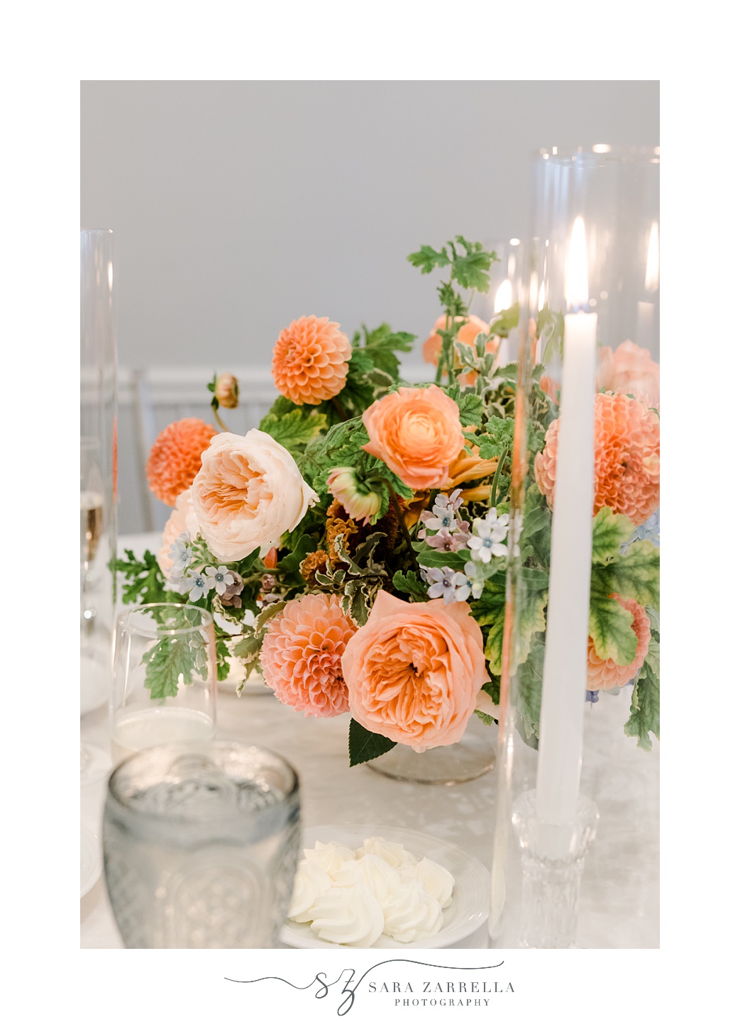 wedding reception centerpieces with peach flowers and taper candles 