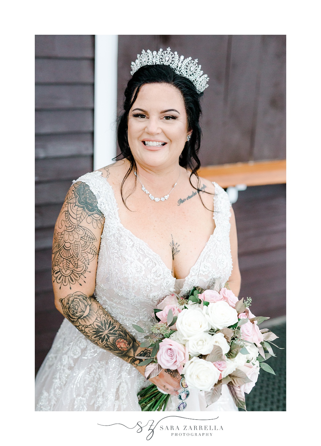 bride holds bouquet of pink and white flowers with crown on head for Blissful Meadows wedding