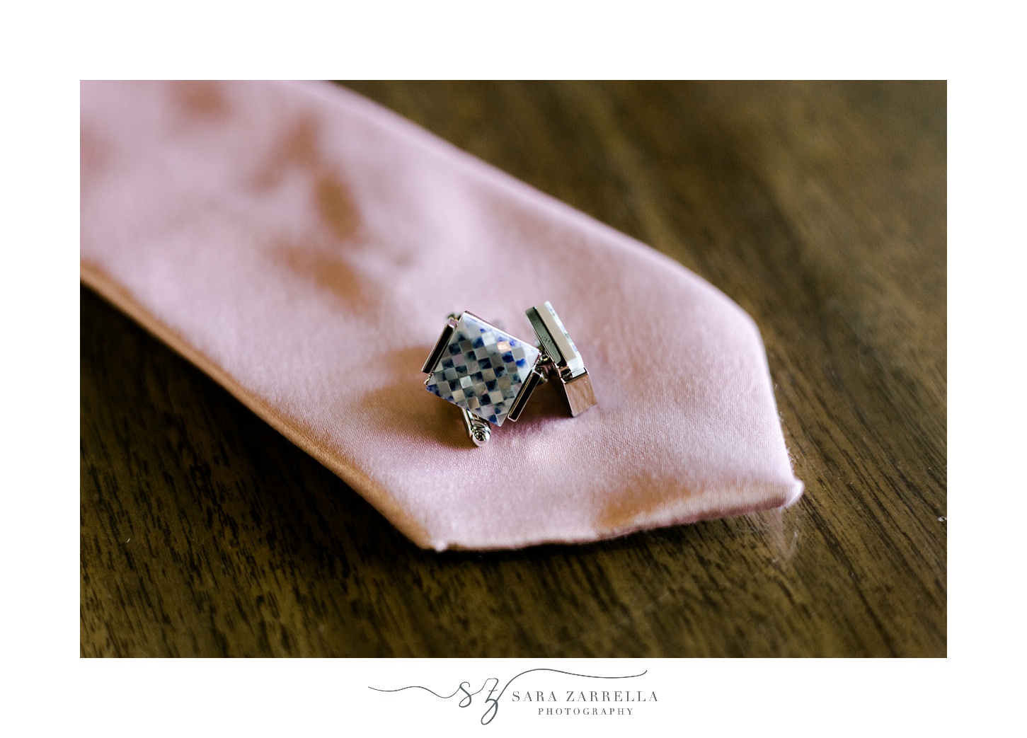 diamond cufflinks rest on end of pink tie before MA wedding 