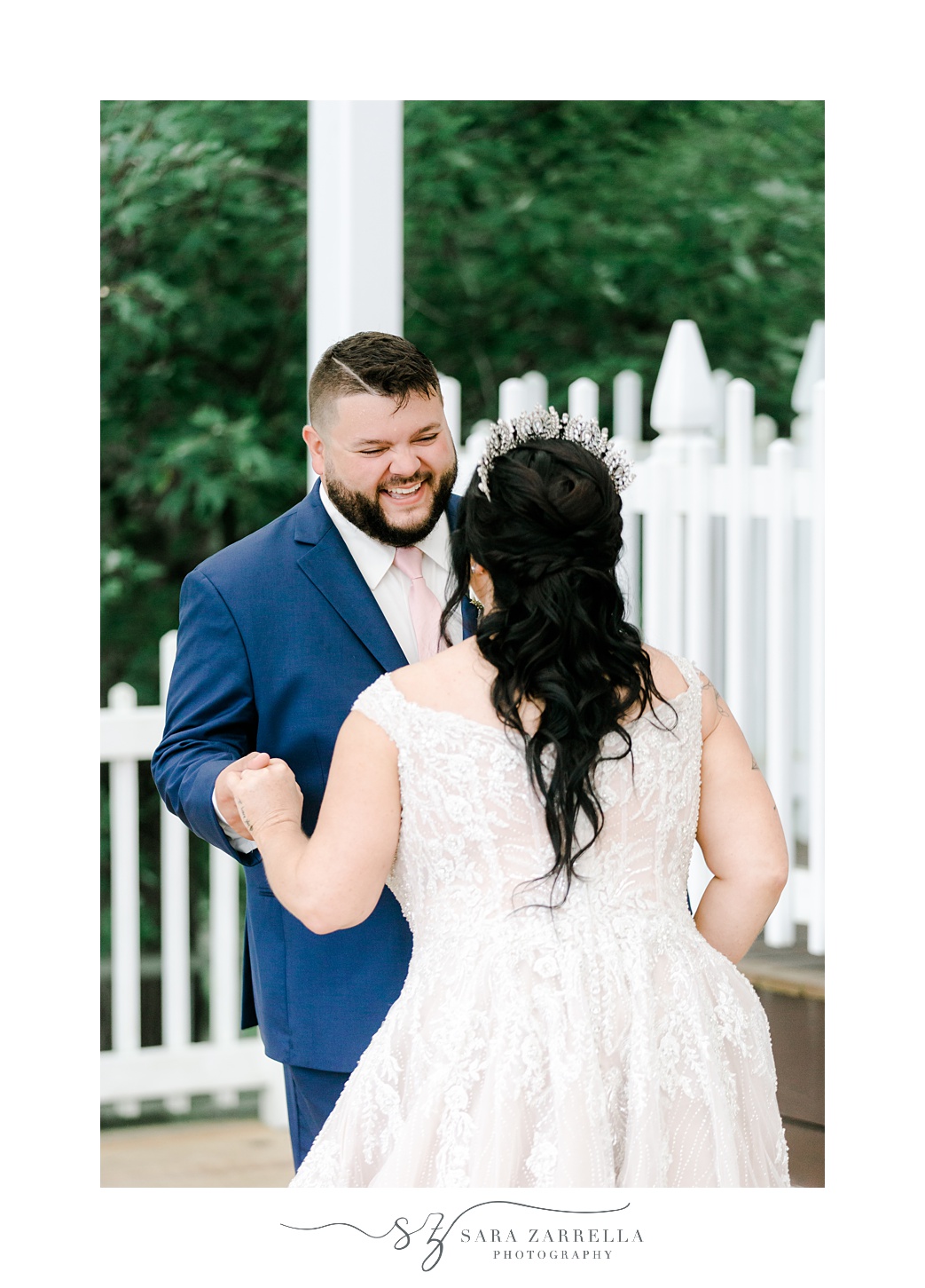 groom smiles at bride during first look in Uxbridge MA