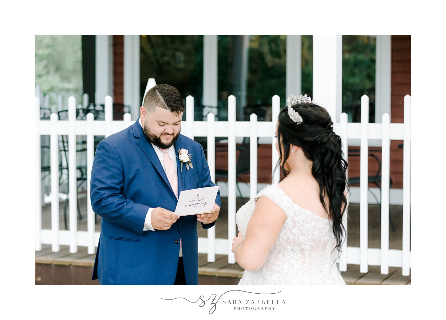 groom reads card to bride during first look at Blissful Meadows