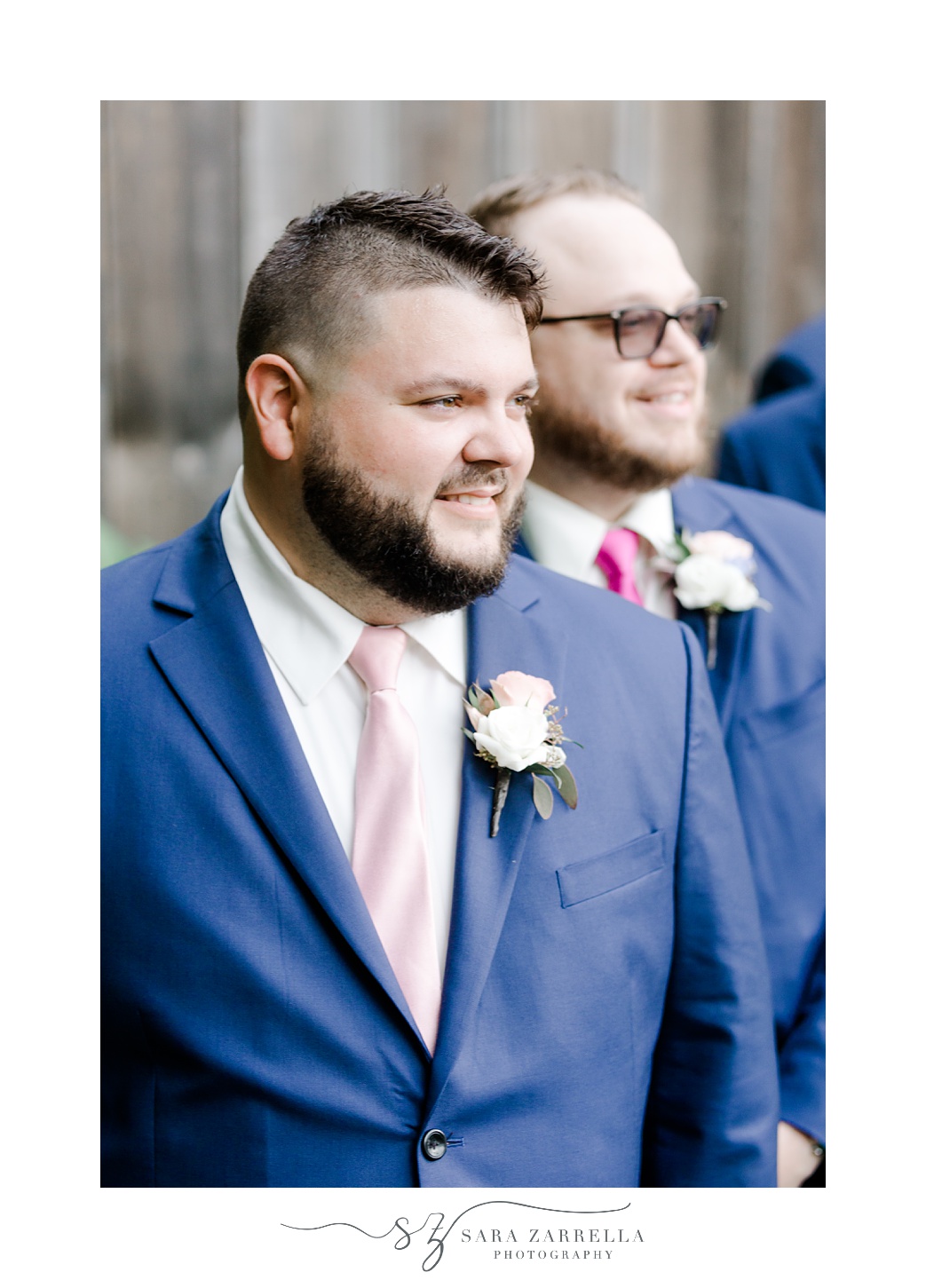 groom smiles at bride walking down aisle during Blissful Meadows wedding ceremony