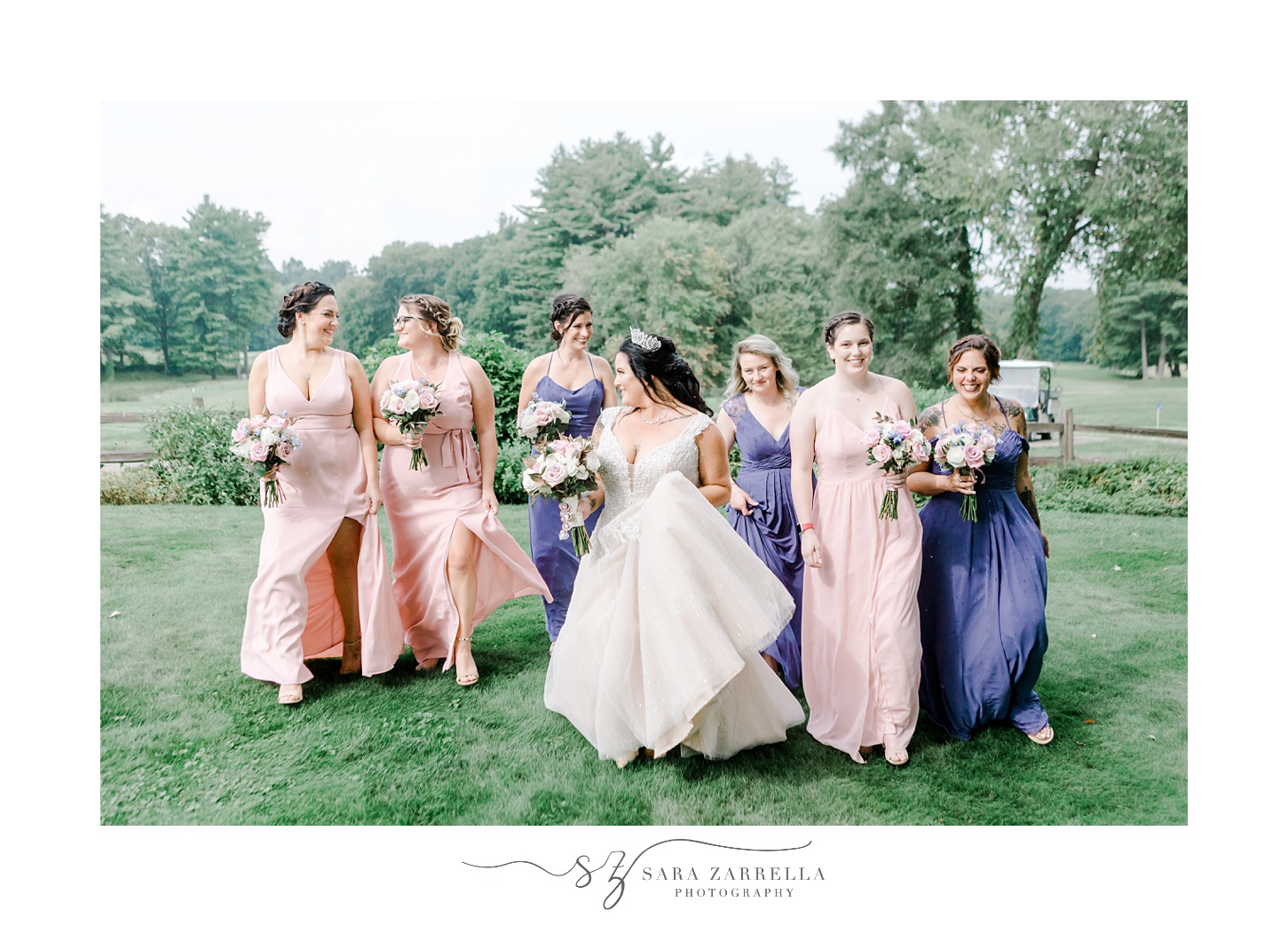 bride walks with bridesmaids on lawn at Blissful Meadows