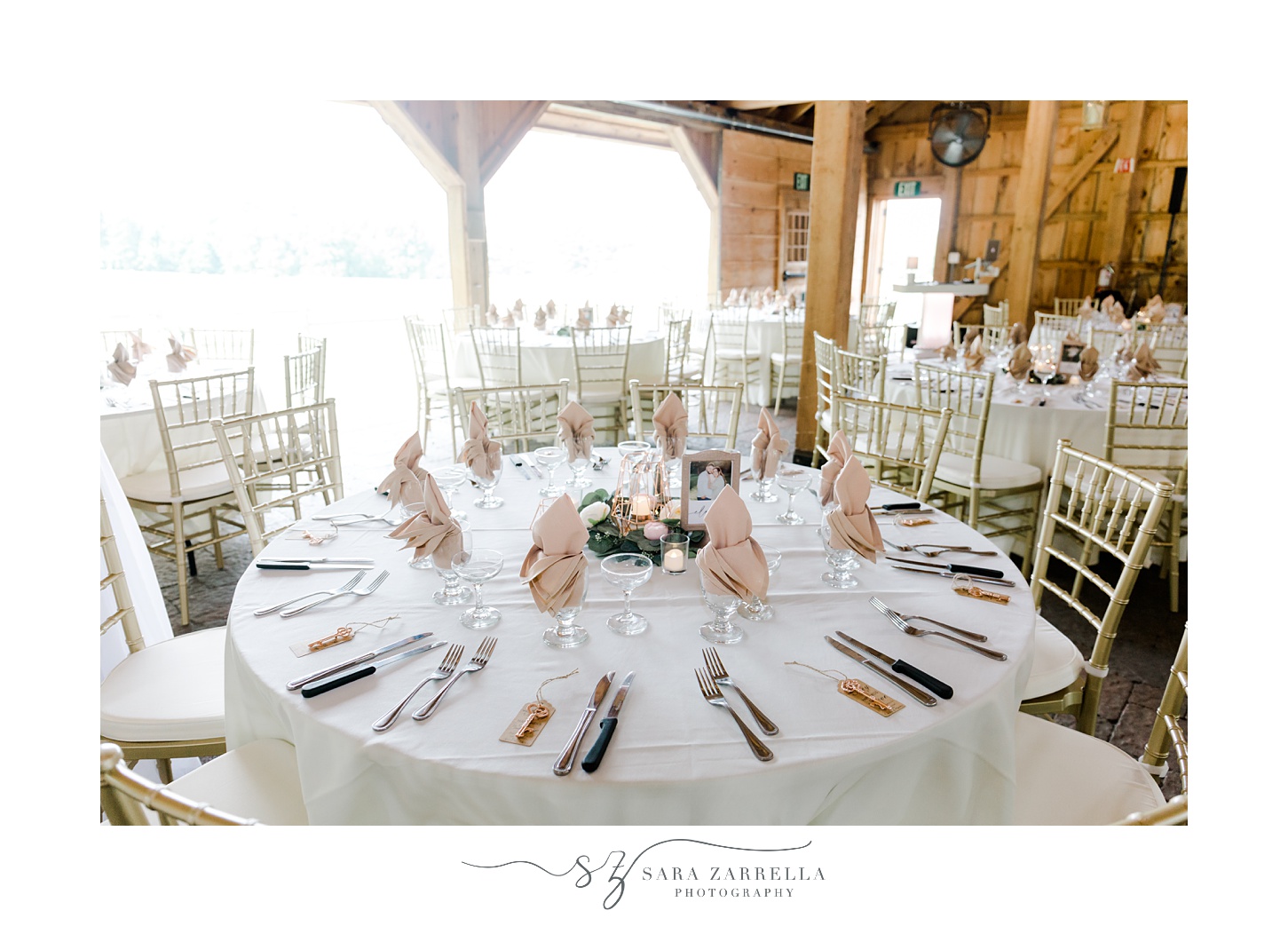 wedding reception in the Pavilion at Blissful Meadows with pink and white flowers 