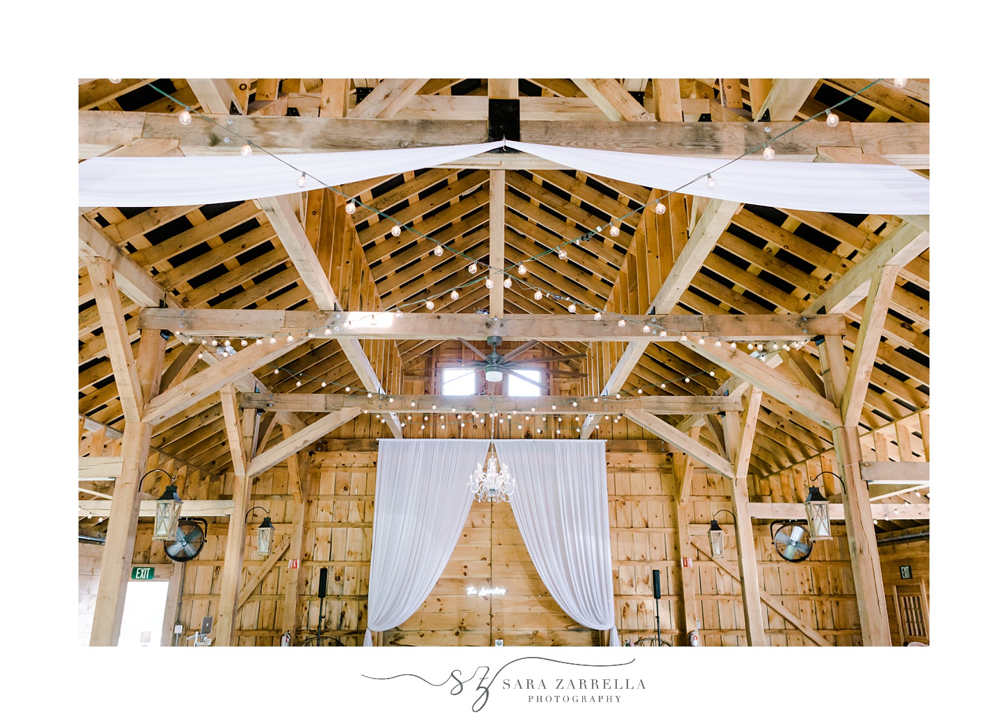 wedding reception in the Pavilion at Blissful Meadows with white linens hanging 