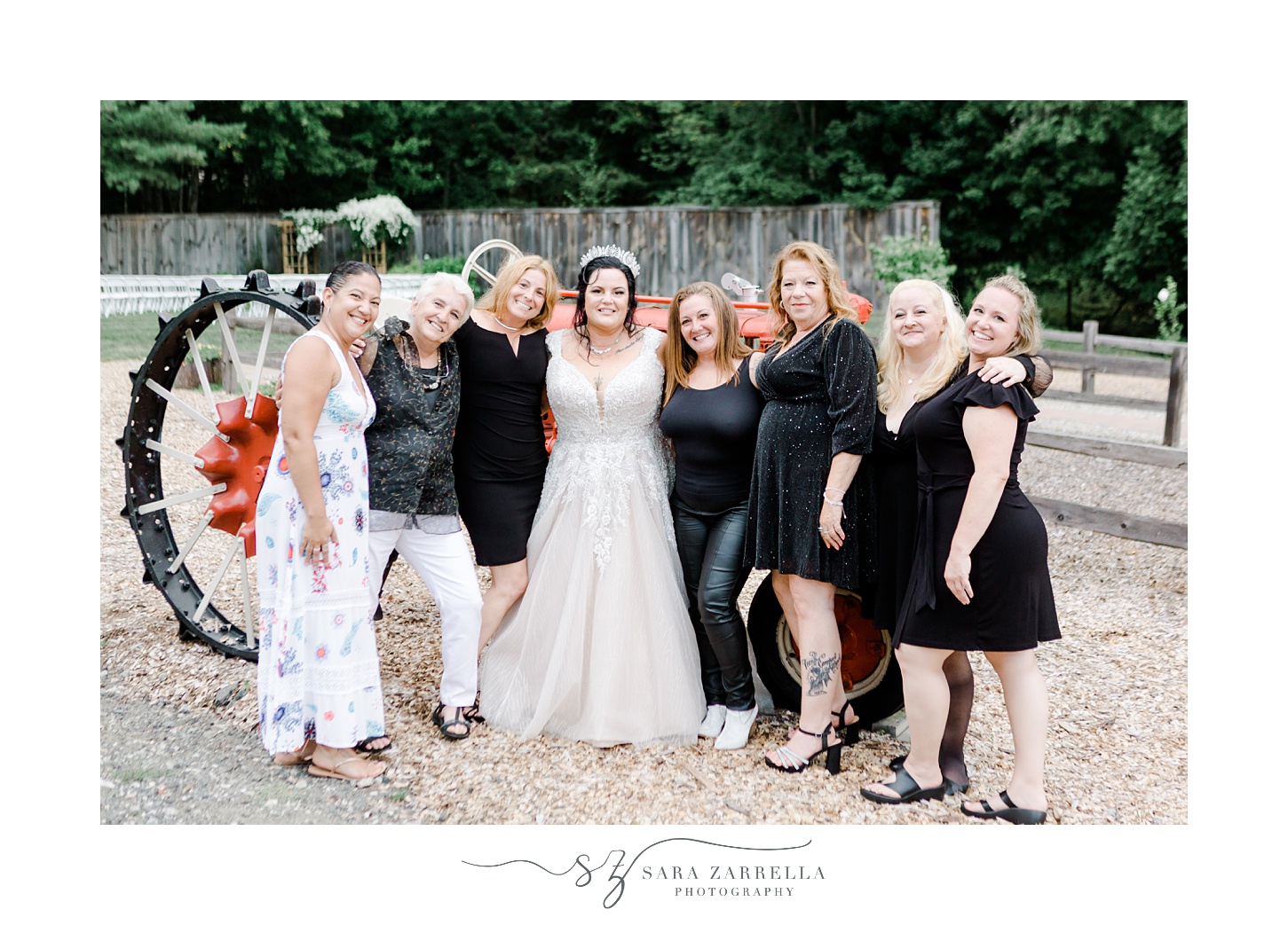 bride poses with guests outside the Pavilion at Uxbridge MA venue