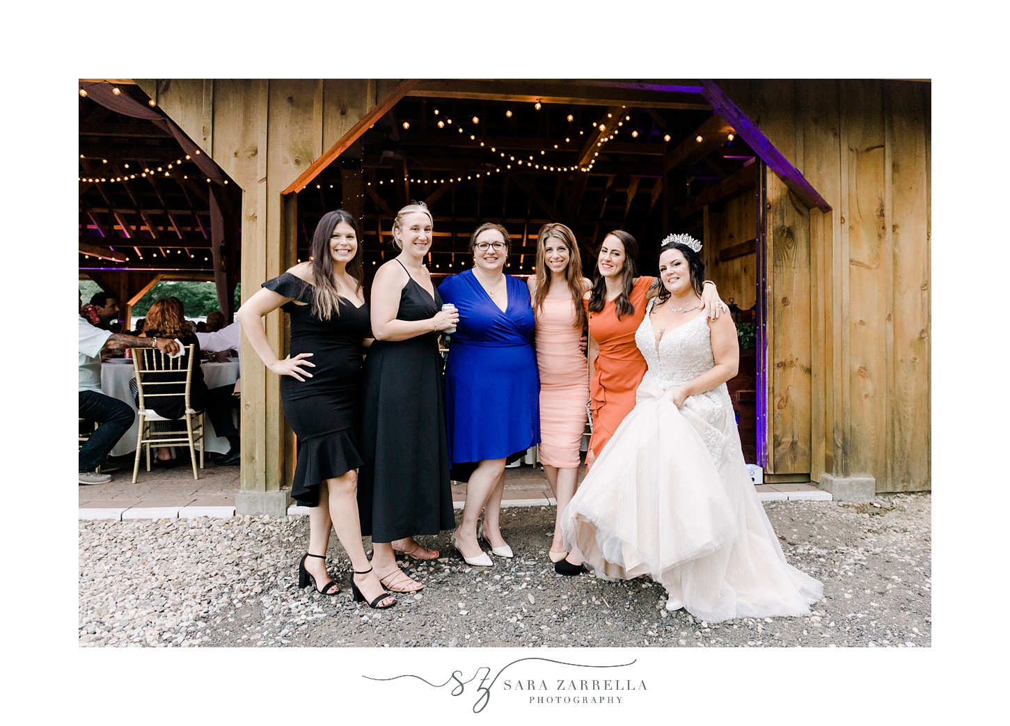 bride poses with guests outside the Pavilion at Uxbridge MA venue