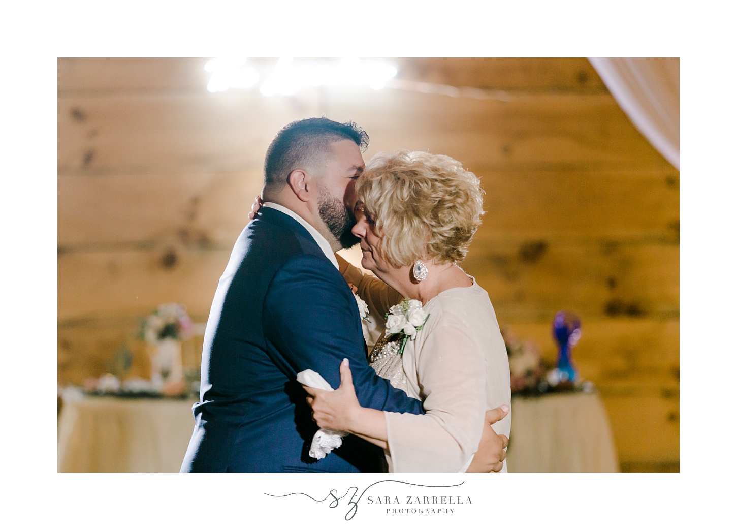 groom and mother dance during wedding reception in Massachusetts 