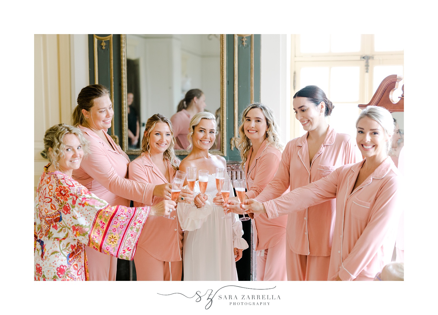bridesmaids laugh with bride drinking champagne at Glen Manor House