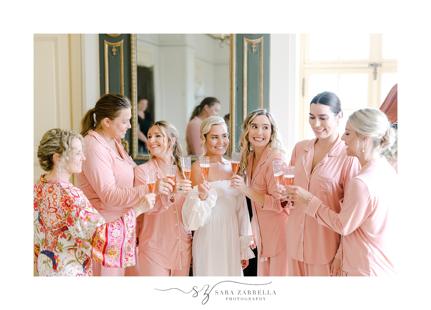 bride and bridesmaids toast during prep in bridal suite at Glen Manor House