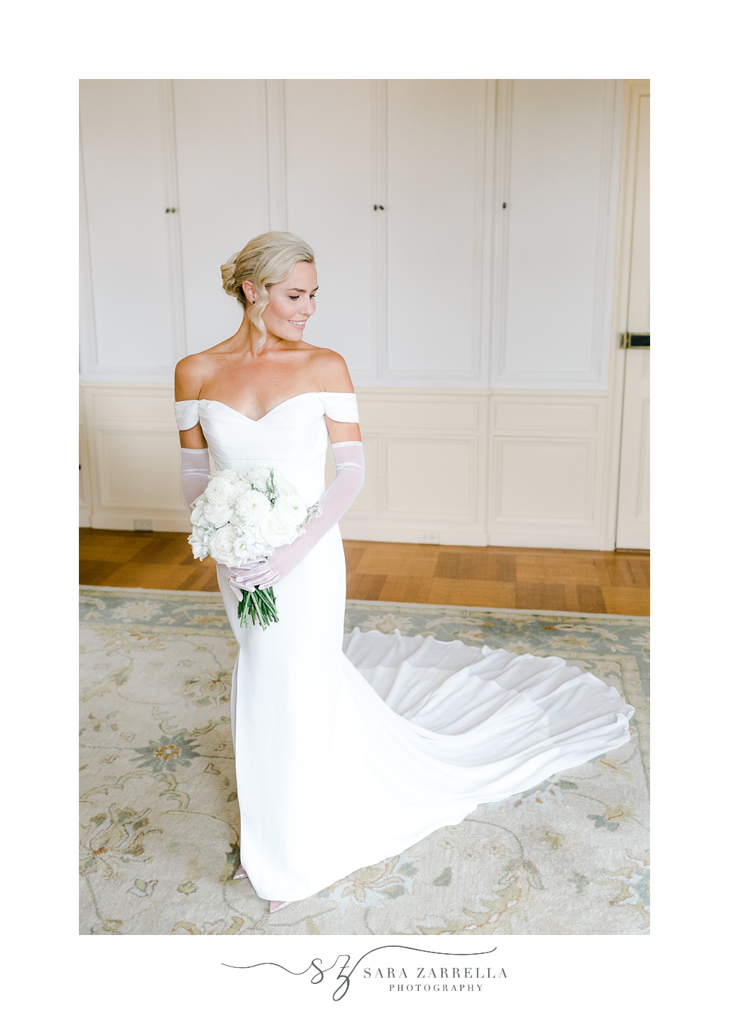bride poses in suite at Glen Manor House with classic French gown and bouquet 